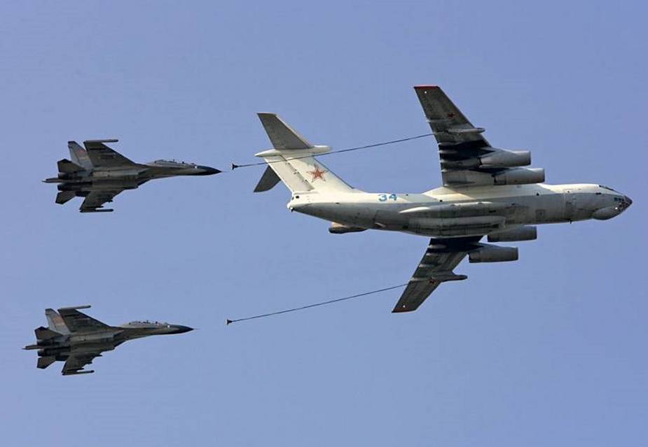 Il 78M 90A air tanker refueling two fighter jets