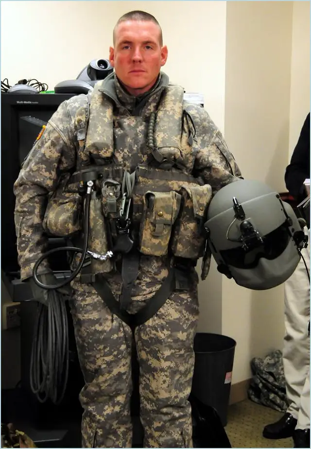 A Soldier displays the Air Warrior ensemble during a media roundtable, March 2, at the Pentagon with Program Executive Office Soldier. The Army is now evaluating the Aircraft Wireless Intercom System that will mean Soldiers will no longer need to be connected to a helicopter's intercom system with cables, which can be cumbersome and potentially dangerous.